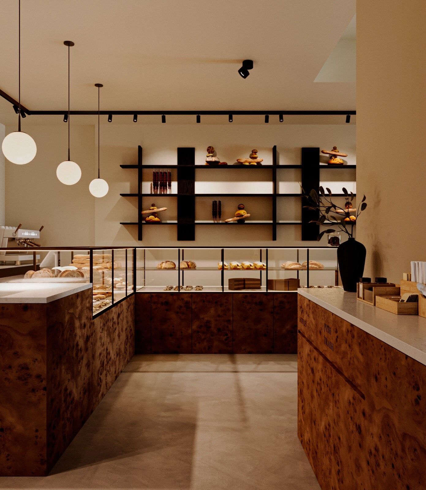 The bakery counter — burl wood, a pastry vitrine, and shelves of fresh bread