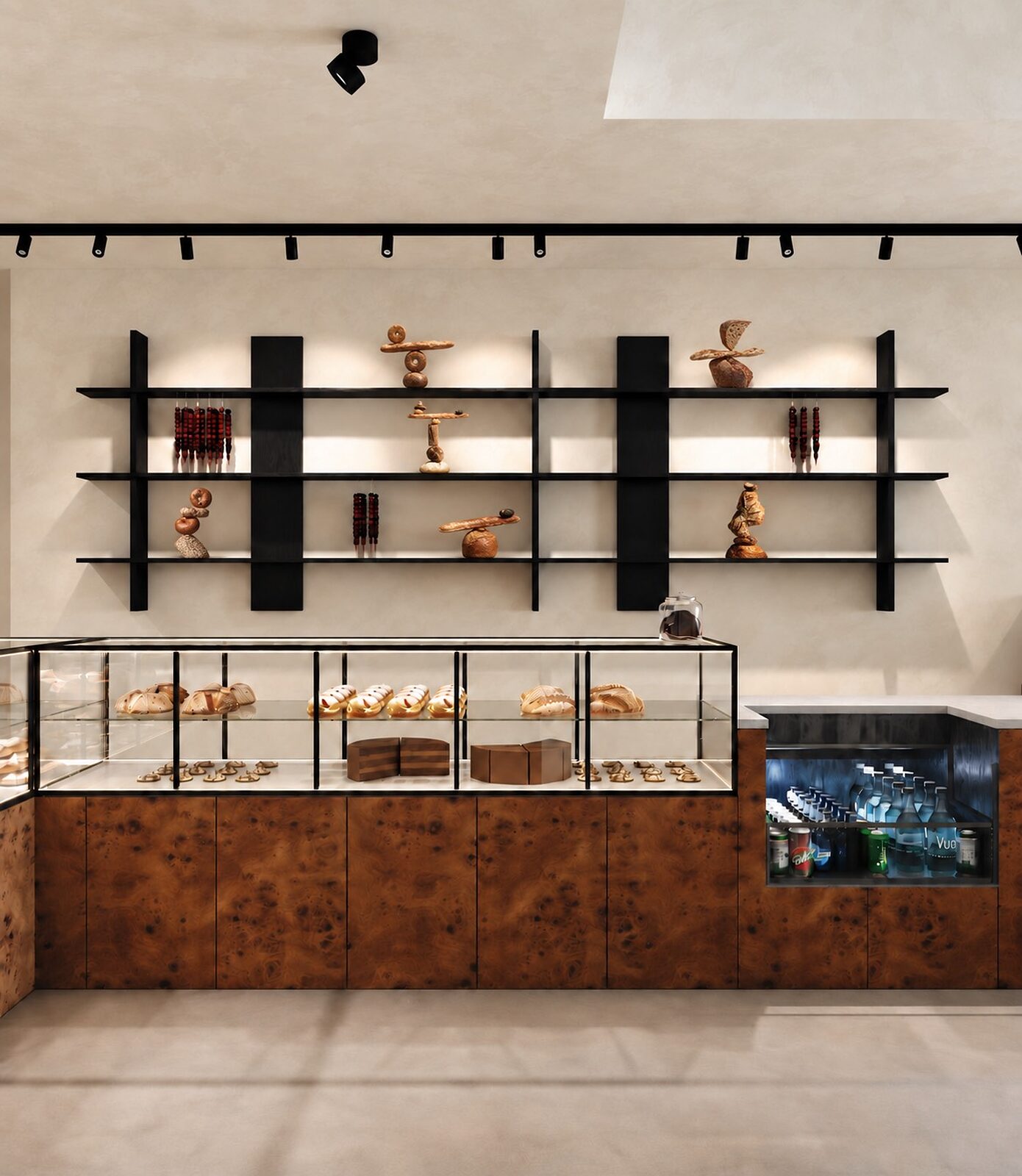 The bakery counter — a burl-wood base, a pastry vitrine, and black steel shelves lined with fresh bread